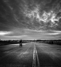 Man on road against sky