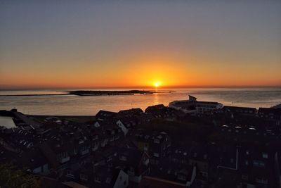 Scenic view of calm sea at sunset