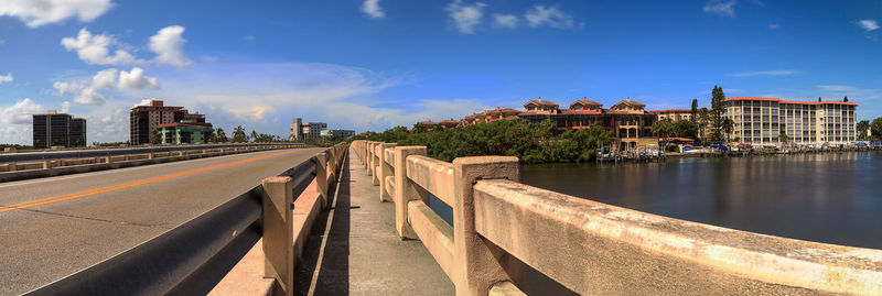 View of bridge over river against buildings