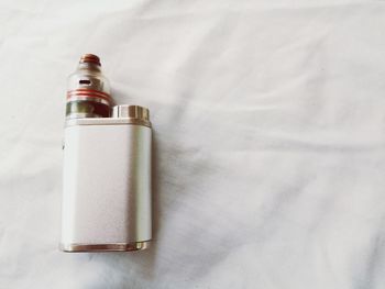 High angle view of bottle against white background