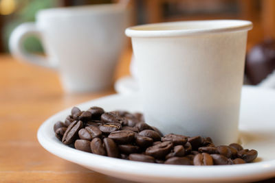 Close-up of coffee cup on table