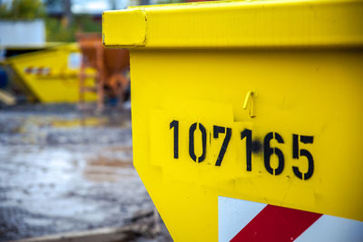 Close-up of information sign on road in city