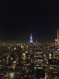 Illuminated buildings in city at night