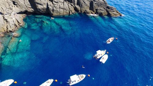 High angle view of boats sailing in sea