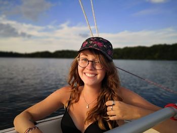 Portrait of a smiling young woman in boat