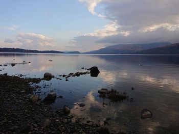 Scenic view of lake against sky during sunset