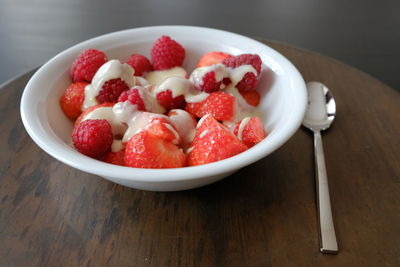 High angle view of strawberries in bowl on table