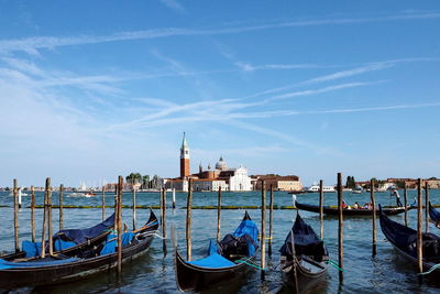 Gondolas moored on canal