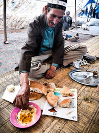 Man eating food on table