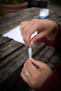 Close-up of hand holding cigarette