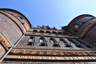 Low angle view of building against clear blue sky