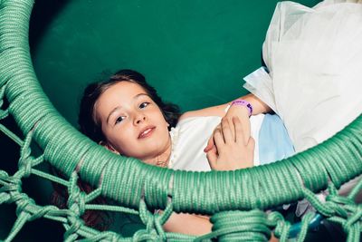 High angle portrait of girl lying down