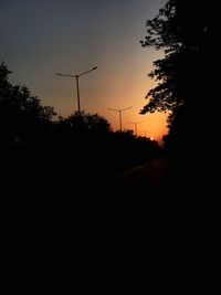 Silhouette trees against sky during sunset