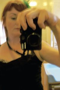 Woman photographing through smart phone