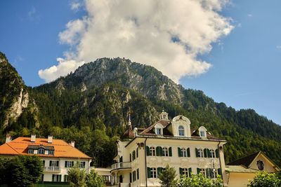 Buildings in town against sky