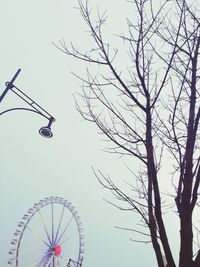 Low angle view of ferris wheel against sky