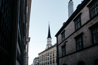 Low angle view of clock tower against sky