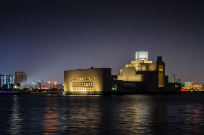 Traditional dhow moored near the museum of islamic art doha, qatar. 