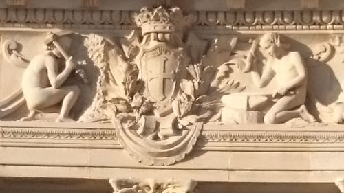 Close-up of carvings in front of building