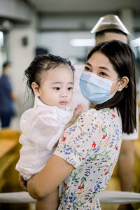 Portrait of cute baby girl indoors