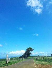 Empty road along countryside landscape