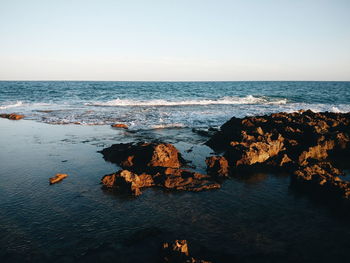 Scenic view of sea against clear sky