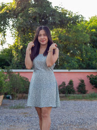 A asian nationality thai woman wearing blue dress and feel good