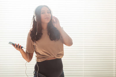 Young woman using mobile phone