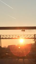 Sun shining through bridge