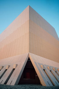 Low angle view of building against blue sky