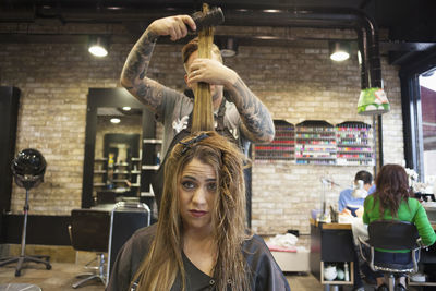 Portrait of woman sitting in store