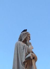 Low angle view of statue against clear sky