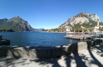 Scenic view of bay against clear blue sky