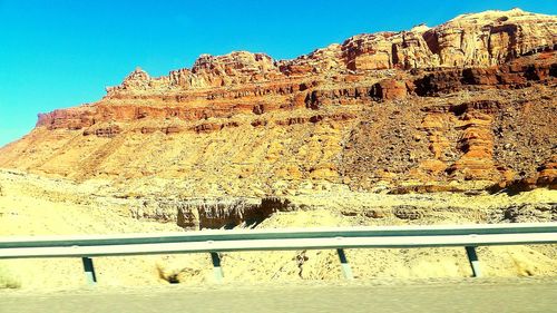 Scenic view of rocky mountains against clear blue sky