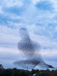 Low angle view of water splashing against sky