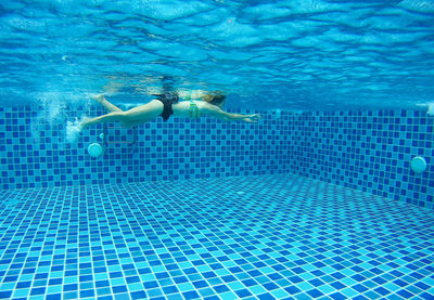 Woman swimming in pool