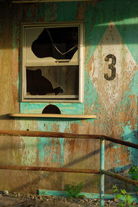 Broken window of old abandoned building