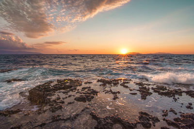 Scenic view of sea against sky during sunset