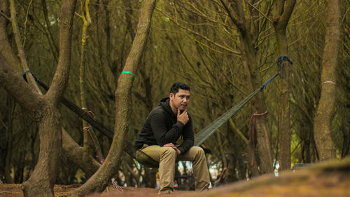 Full length of young man in forest