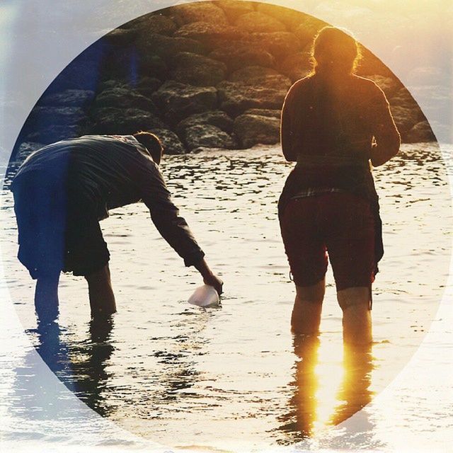 lifestyles, water, togetherness, leisure activity, full length, bonding, beach, standing, person, love, men, boys, childhood, reflection, casual clothing, friendship, walking