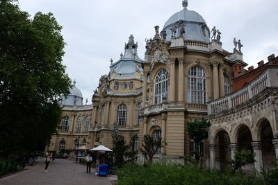 People in front of building