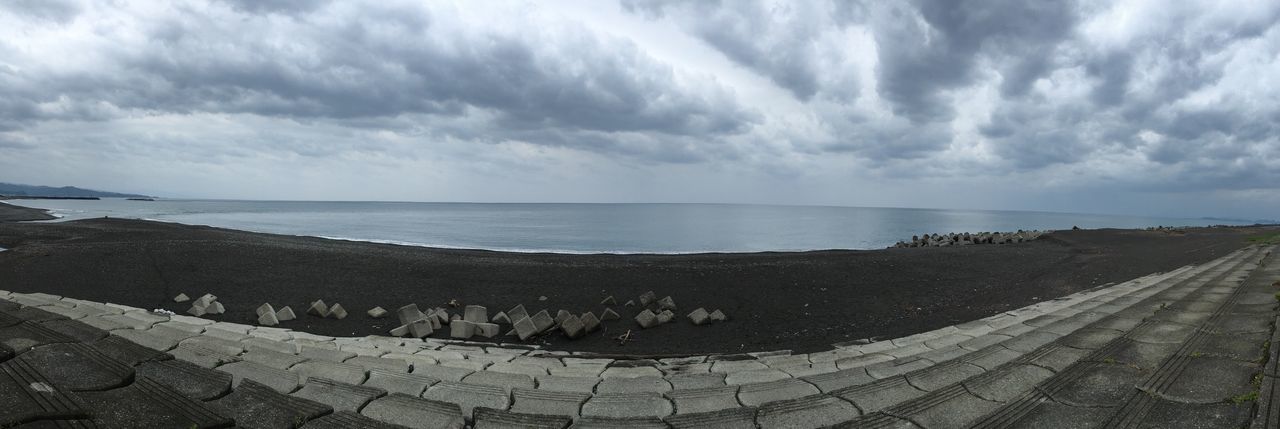 sky, sea, horizon over water, water, tranquil scene, tranquility, cloud - sky, scenics, beach, cloudy, beauty in nature, nature, shore, cloud, idyllic, remote, day, weather, outdoors, sand