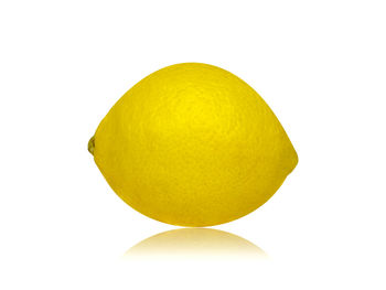 Close-up of lemon slice against white background