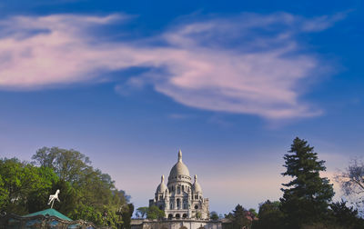 View of temple building against cloudy sky