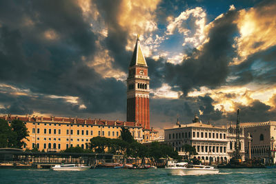 View of buildings against cloudy sky