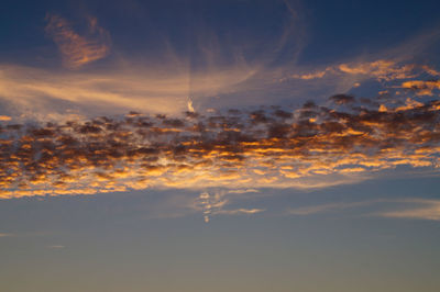 Scenic view of dramatic sky at sunset