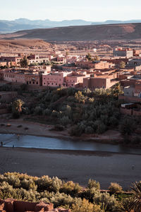 High angle view of river by buildings in city