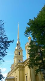 Low angle view of church against blue sky