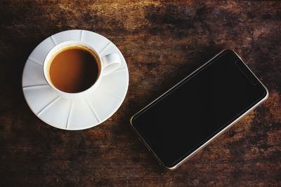 High angle view of coffee cup on table