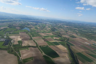 Aerial view of agricultural landscape against sky